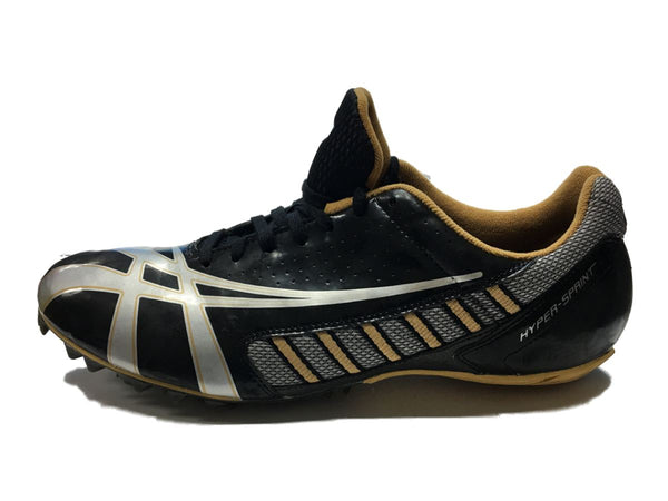black and gold track shoes