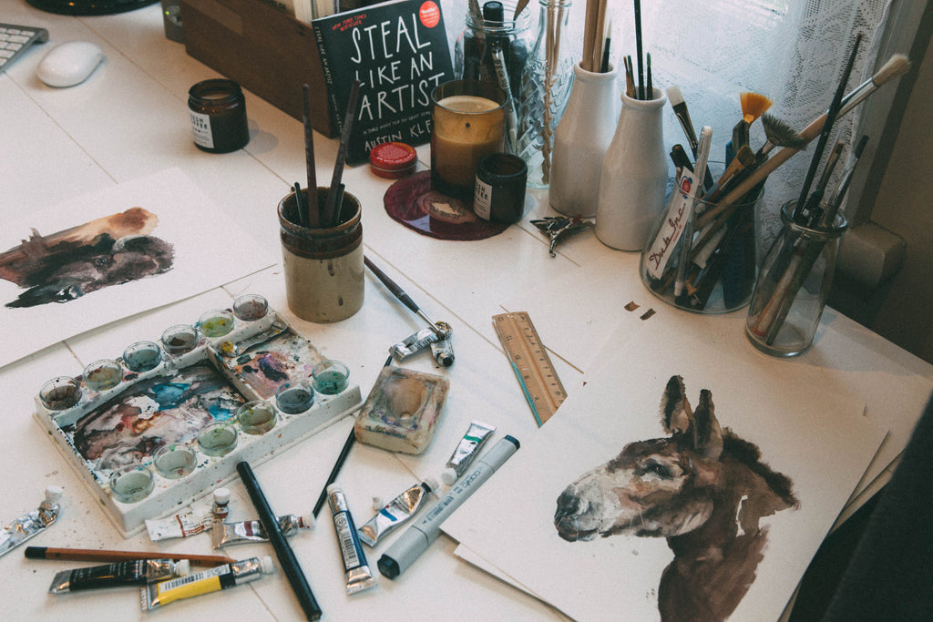 Paints and paint palette on Marie Wade's Desk