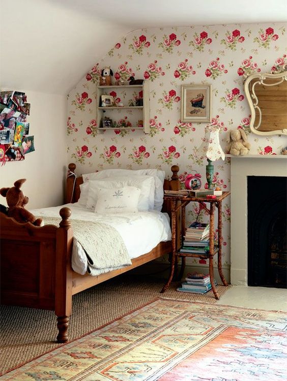 pink floral wallpaper accent wall in girls room