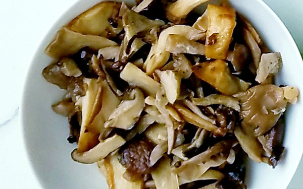 Trim Beech mushrooms by slicing off 1/2 -inch from bottom of root end, and gently separate stems.