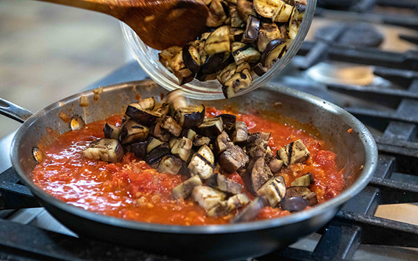 Add garlic, anchovy, chile flakes and Italian seasoning. Continue stirring so it doesn’t stick and cook for about 1 minute.