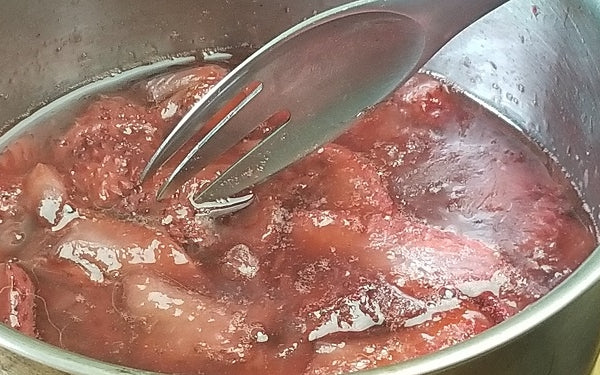 Place sliced strawberries and agave syrup into a medium sized sauce pan. 