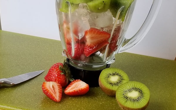 Strawberries and Kiwi in blender.