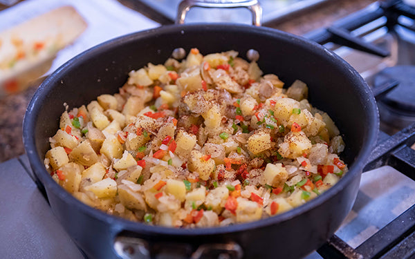 Add the garlic and potatoes and stir to combine. Cook another 10-15 minutes.