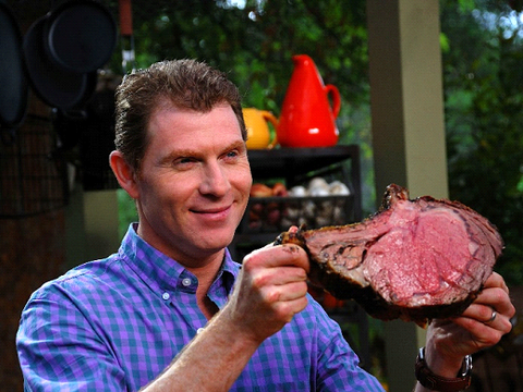 Photo of Bobby Flay Holding Meat