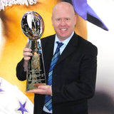 Dan Holding Trophy at NFL Booth