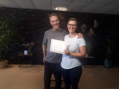 Lee Holden giving Emily Drysdale her Certified Holden Qigong certificate