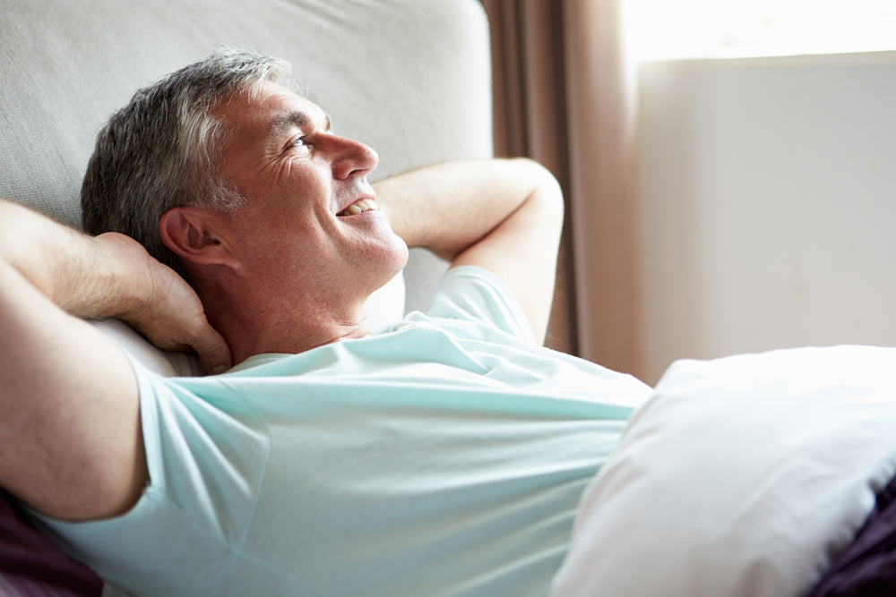 man in bed without heartburn