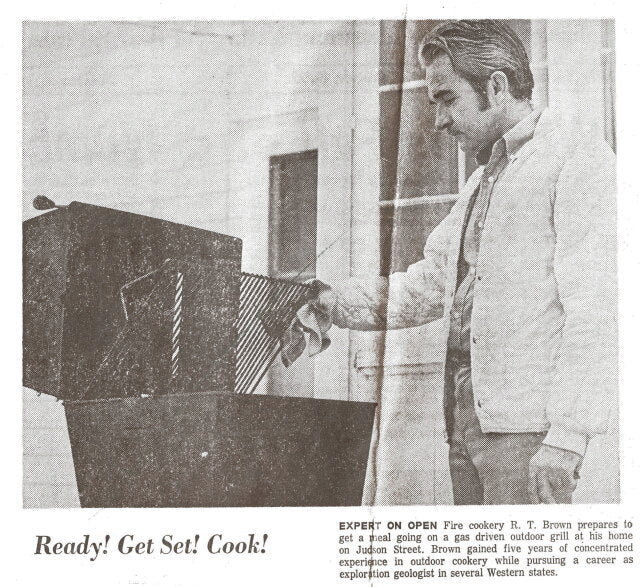 EXPERT ON OPEN Fire cookery R.T. brown prepares to get a meal going on a gas driven outdoor grill at his home on Judson Street. Brown gained five years of concentrated experience in outdoor cookery while pursuing a career as exploration geologist in several western states.