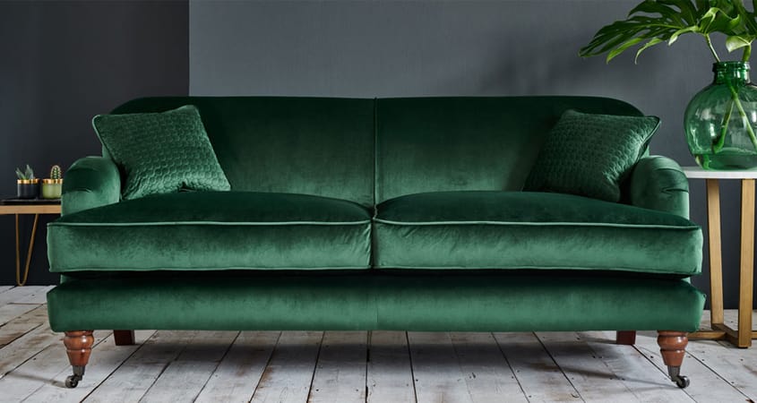 Emerald green sofa with gold tones