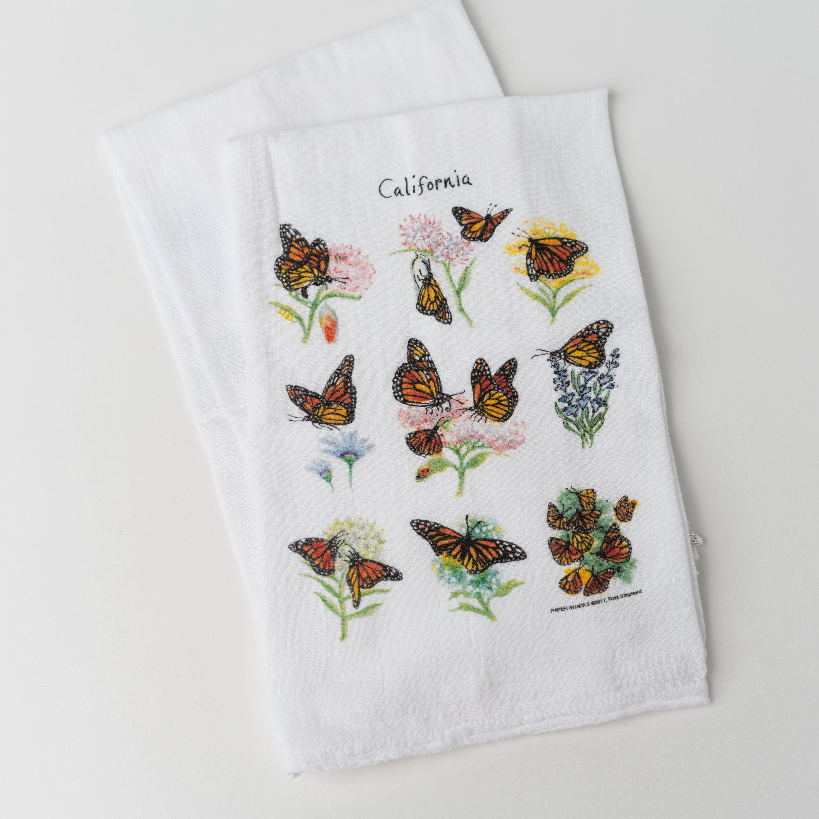 White towel with illustrations of Monarch Butterflies