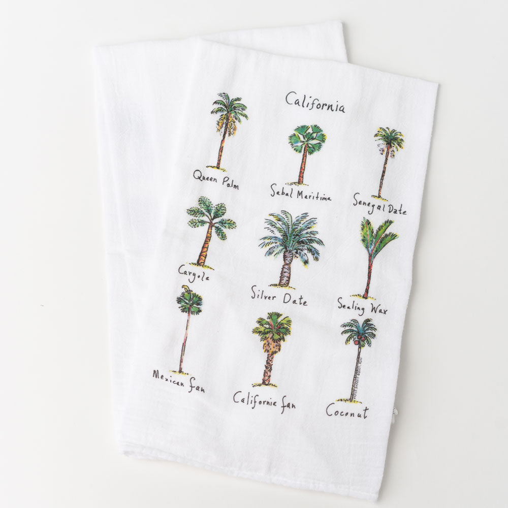White towel with 9 different images of palm trees