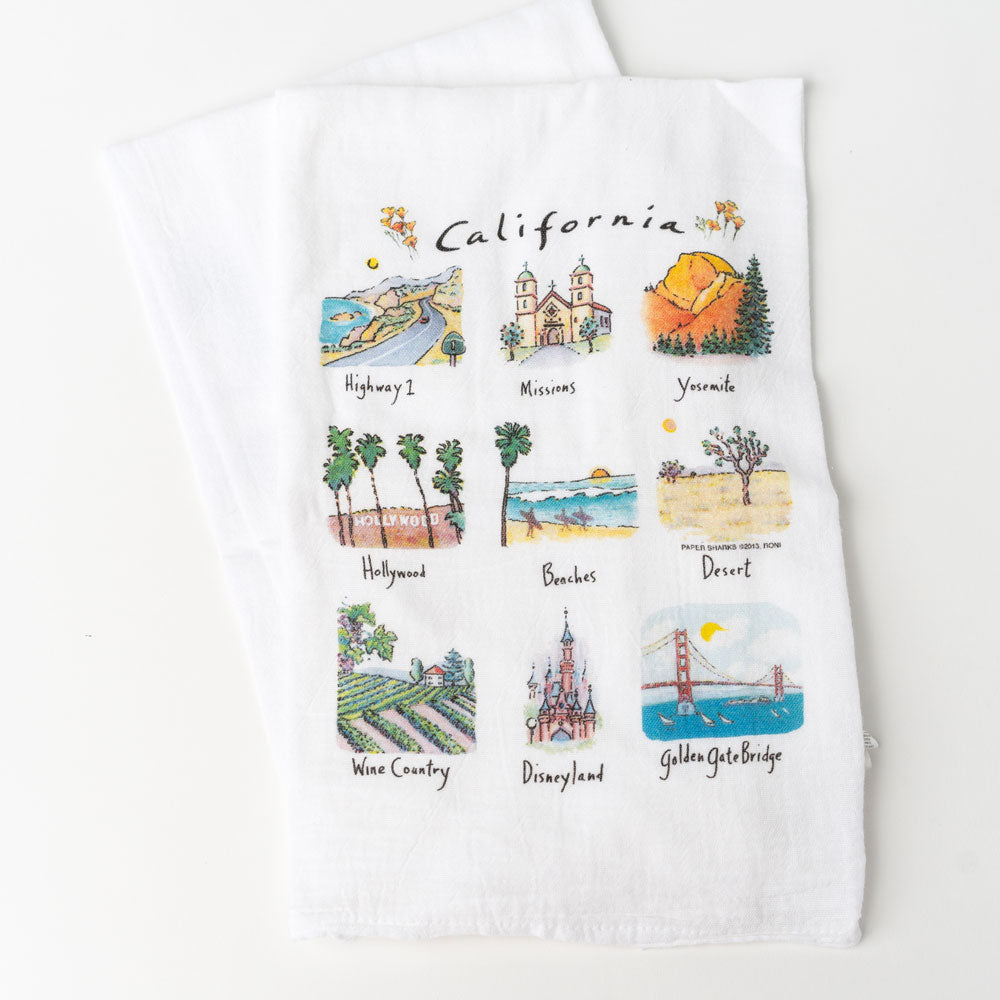 White towel with sketches of 9 different landmarks in california