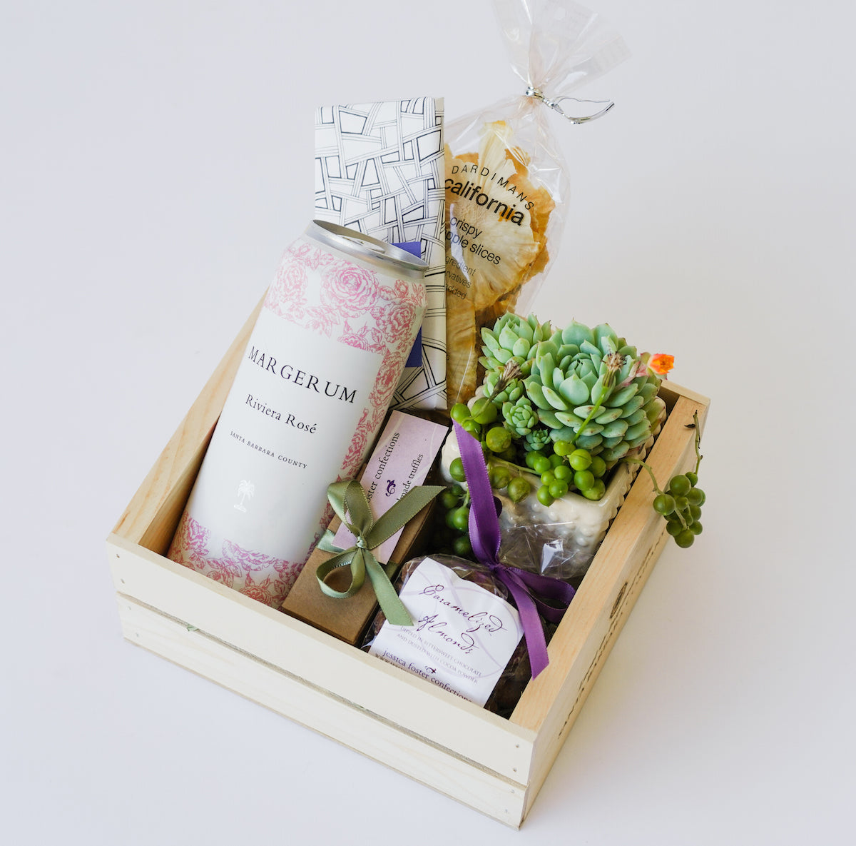 Wood Crate with can of wine, succulent, chocolate bar, truffles, caramelized almonds, and dried pineapple