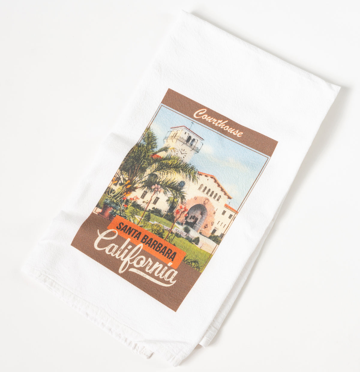 White kitchen towel with vintage style image of the Santa Barbara Courthouse