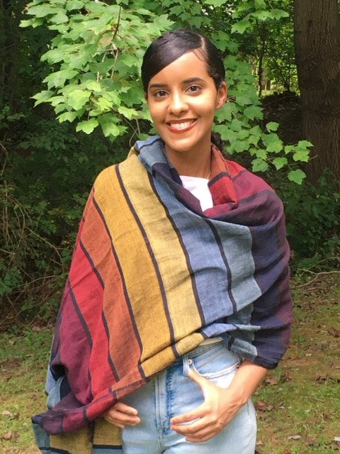 Aida, from our partner, Nothing But Nets, wears a Shoo for Good, mosquito-repellent scarf. 100% cotton,  enhanced with Insect Shield and their permethrin treatment, it keeps insects away.