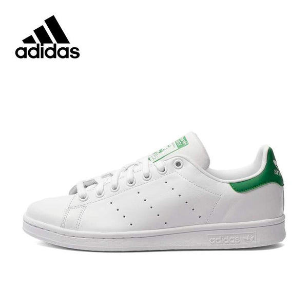 white and green adidas shoes