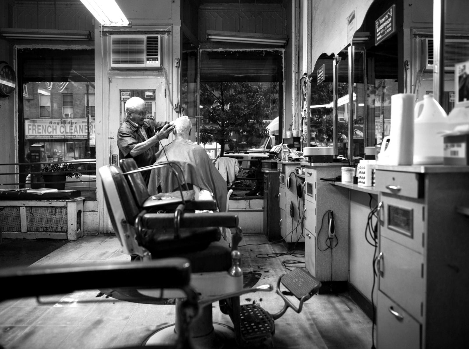 Man getting his hair cut by Barber