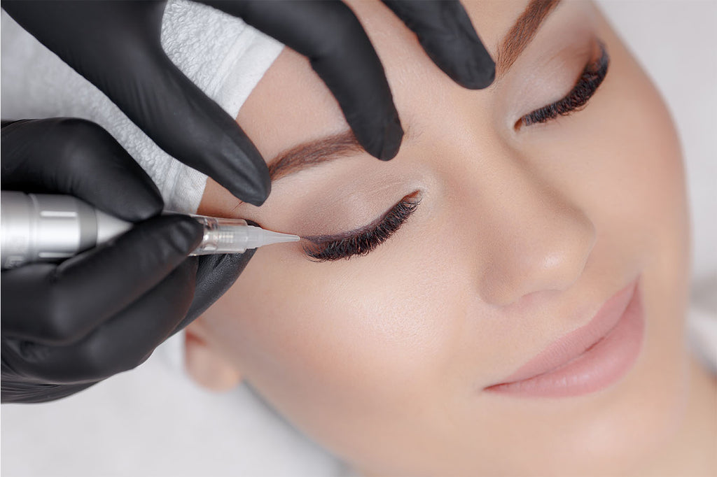 Semi-permanent eyeliner complements long dark lashes well as it defines the eye