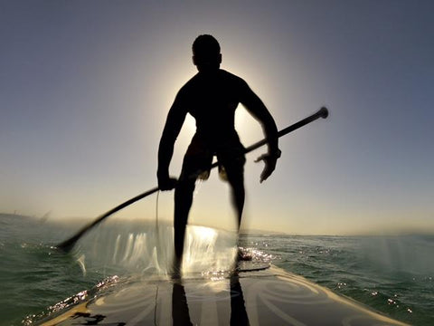Man paddle boards