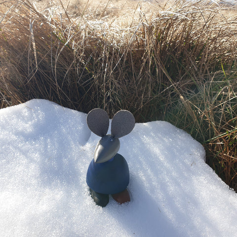 wooden toy in snow