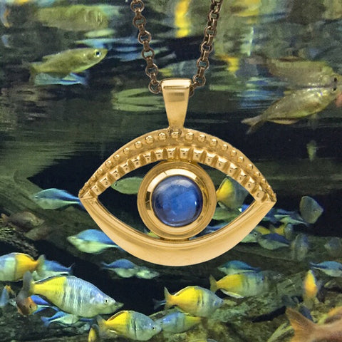 Gold evil eye pendant necklace with blue kyanite gemstone