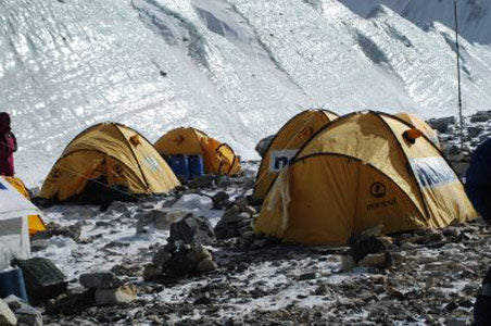 tents near an icy incline