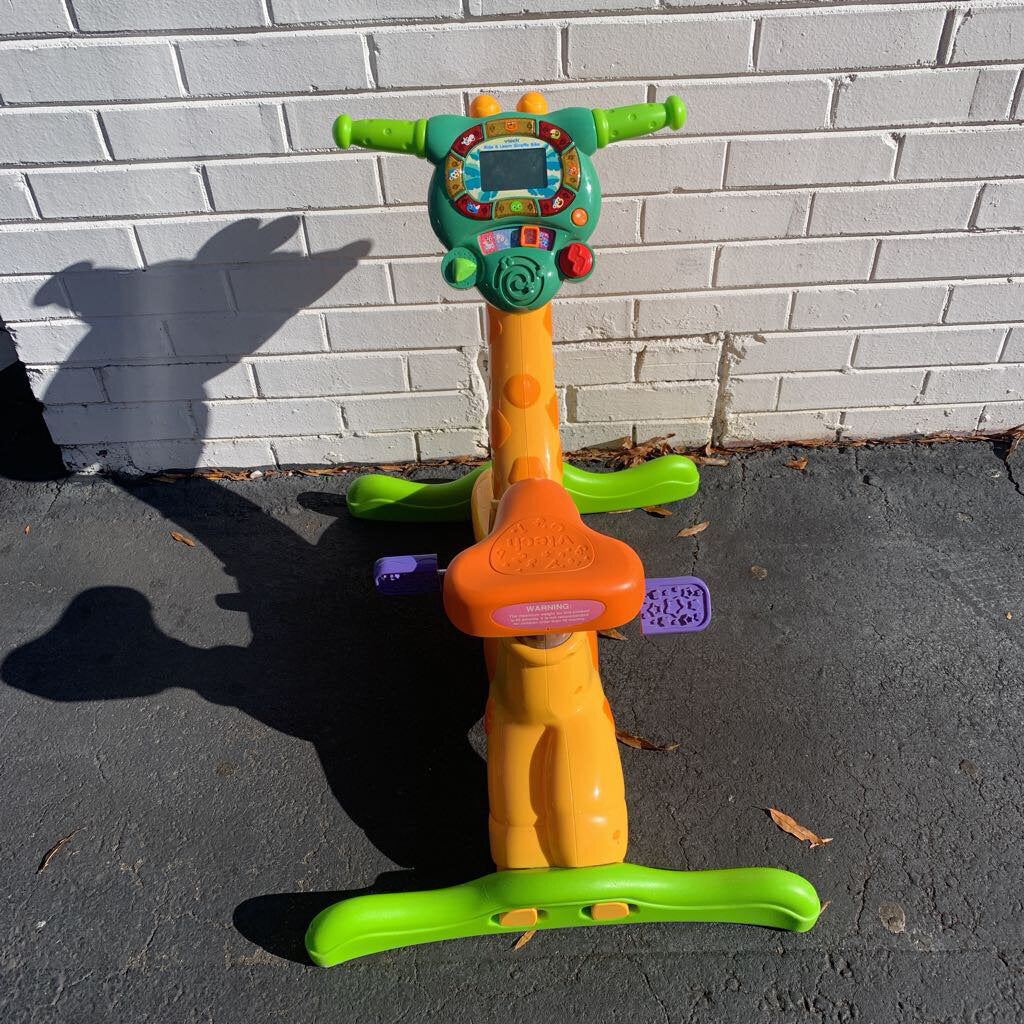 vtech ride on giraffe bike