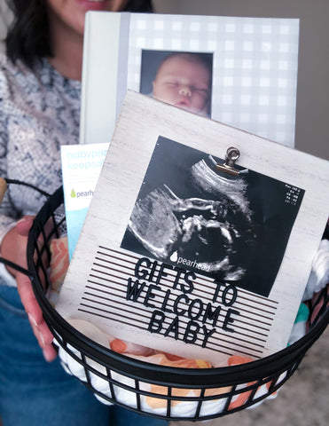 Gift idea to welcome new baby: use a letterboard to create a message for new baby, wrap up in a gift basket with other keepsakes and baby essentials. 