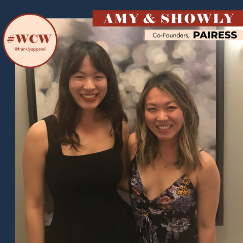 Image of the two founders, Amy and Showly, smiling in front of a piece of art.