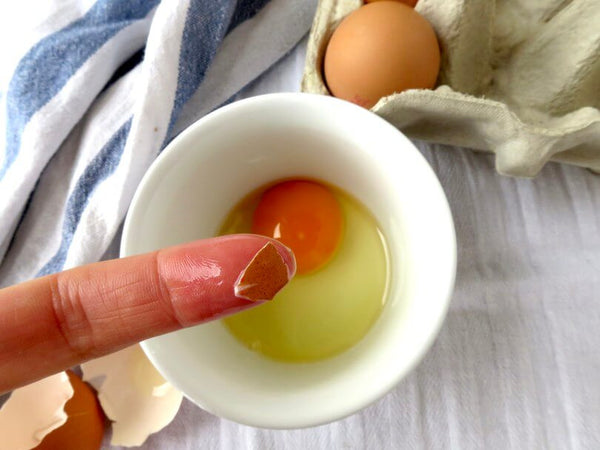 Baking Hack - Use a wet finger to remove eggshells