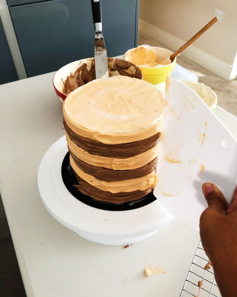 Chocolate Orange Drip Cake Recipe - scrape buttercream stripes