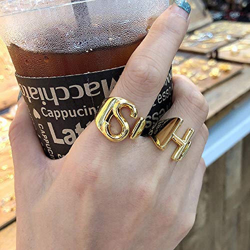 Gold rings with store letters on them