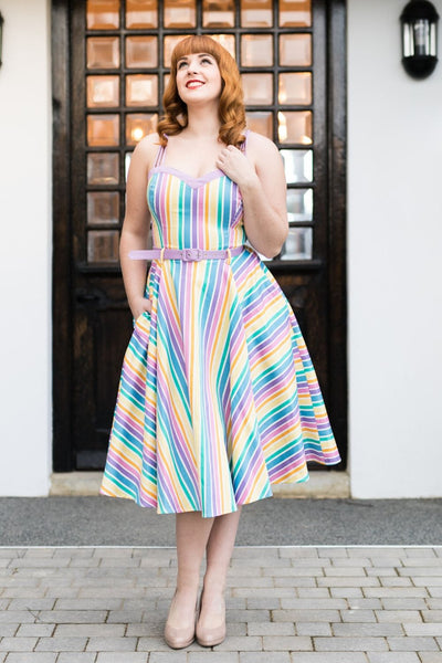 Girl in 1950s dress in rainbow colours