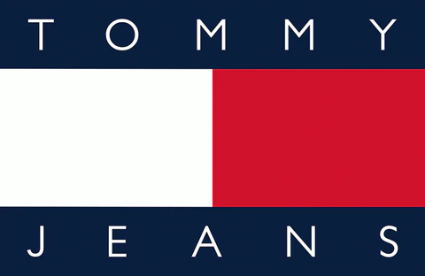 A logo sign outside of a Tommy Hilfiger retail store location in