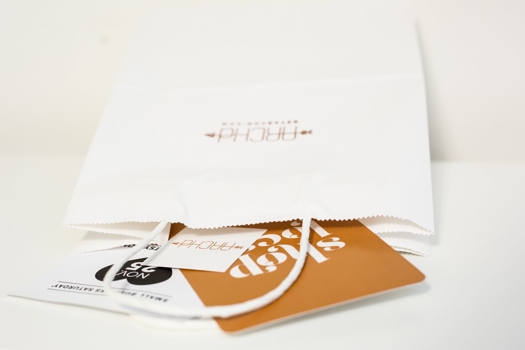 Vendor booth idea tip stamp logo on white paper bags for customers ARCHd