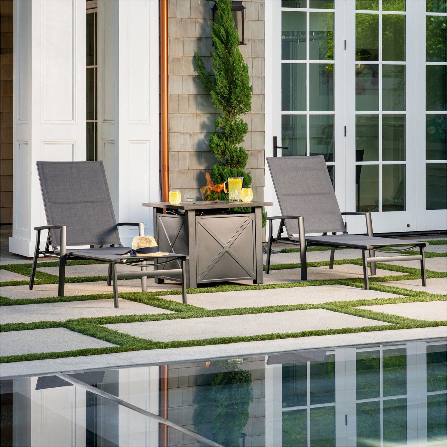 Hanover Chaise Lounge Halsted 3-Piece Sling Lounge Set featuring a 40,000 BTU Tile-Top Fire Pit Table with Burner Cover in Gray | HALCHS3PCFP-GRY Hanover Chaise Lounge Halsted 3-Piece Sling Lounge Set featuring a 40,000 BTU Tile-Top Fire Pit Table with Burner Cover in Gray | HALCHS3PCFP-GRY