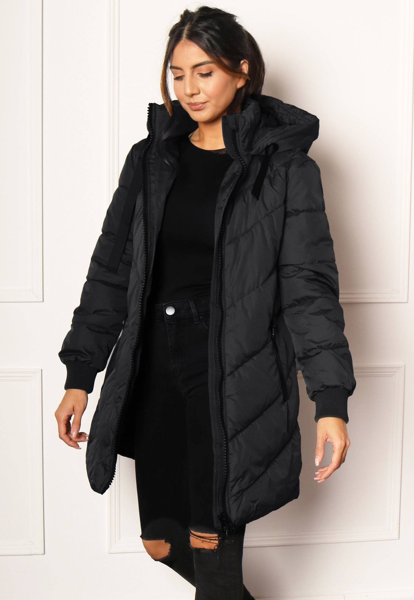 JDY Skylar Chevron Quilted Longline Hooded Puffer Coat in Black - concretebartops