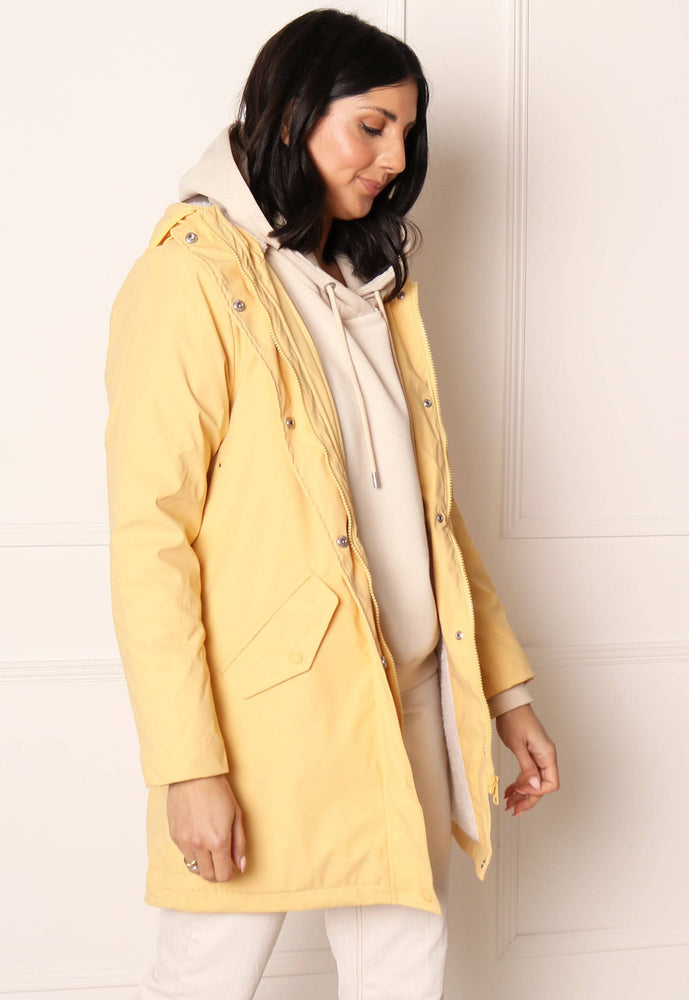 ONLY Sally Rubberised Matte Hooded Raincoat Mac with Shearling Lining in Yellow - concretebartops
