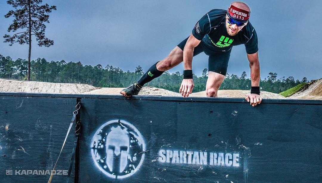 Lefty Kapanadze over wall at Spartan Race