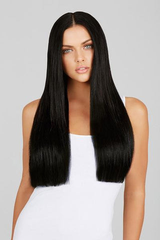 woman with black hair wearing hair extensions
