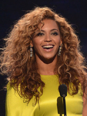Beyonce with long curly brown hair