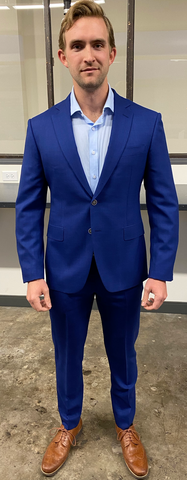man in custom blue suit