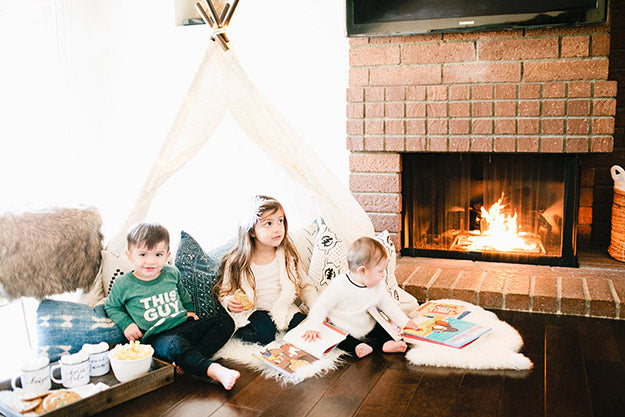 Cozy play date for littles with teepee, fireplace, and snacks