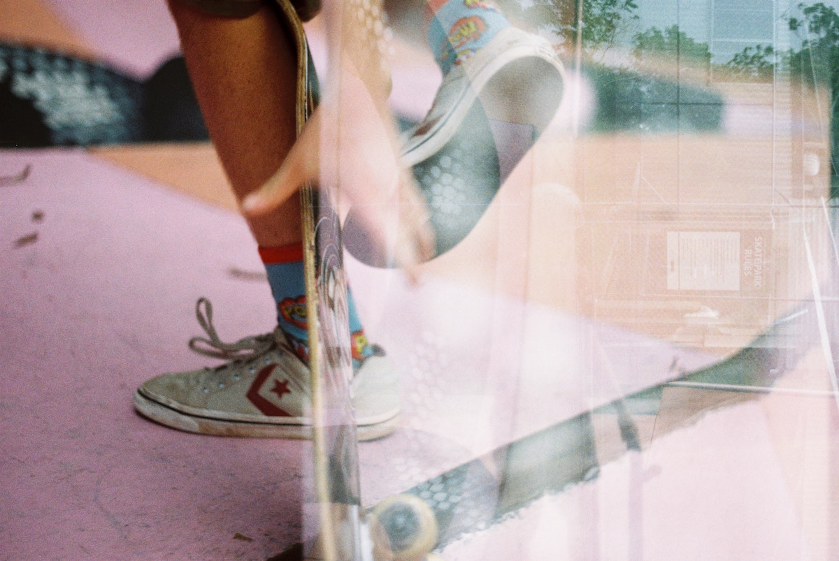 retro photo of legs and a skateboard