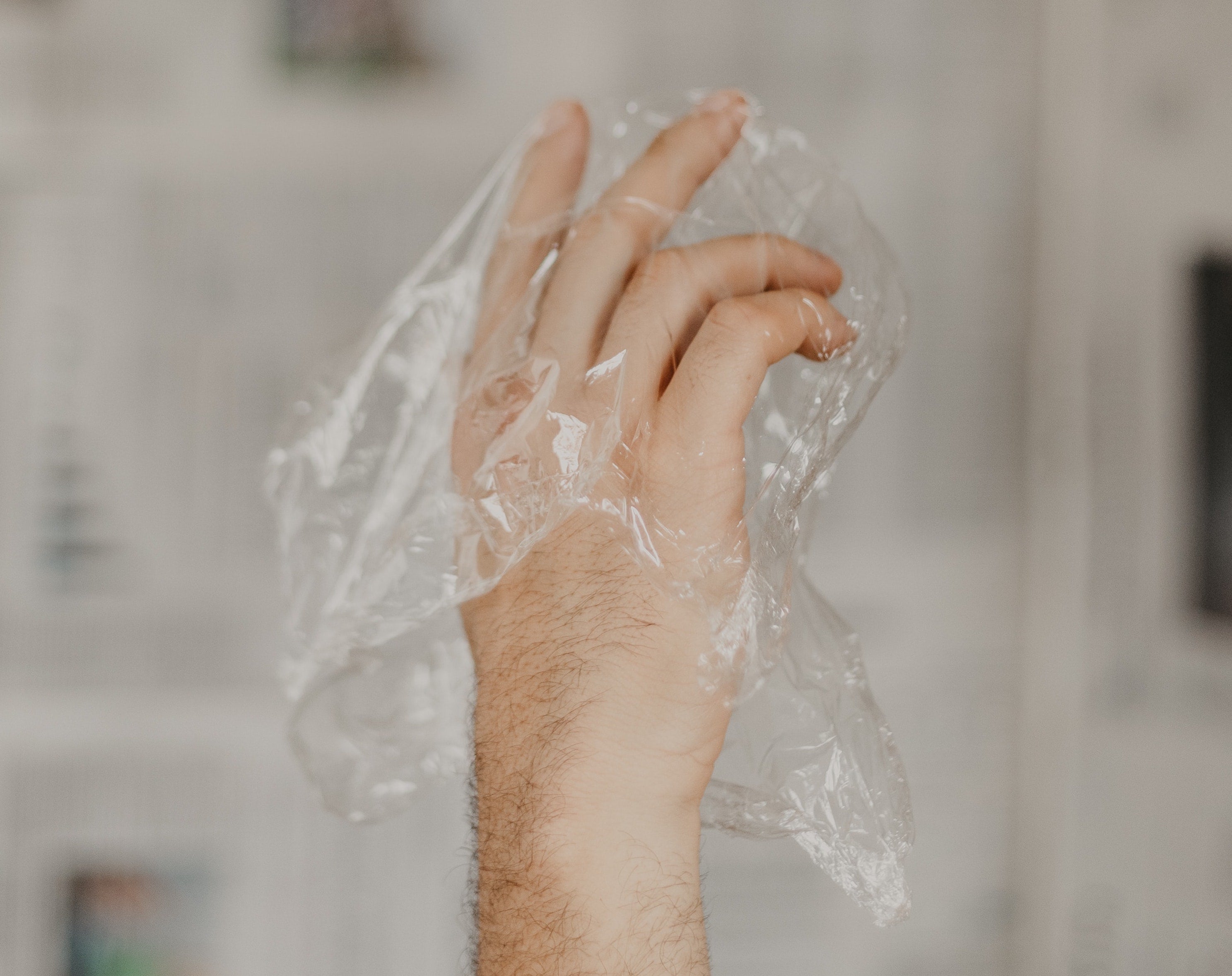 Dainty hand in a plastic bag