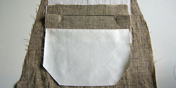 Pocket lining pressed downwards