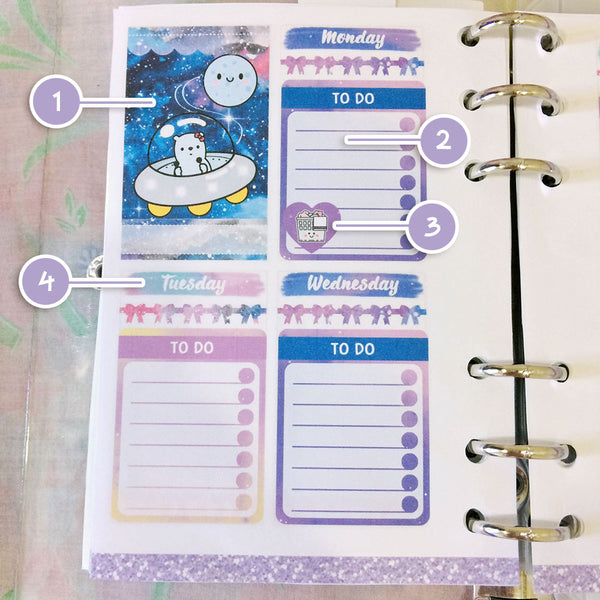 Galaxy printable planner stickers on a planner spread.