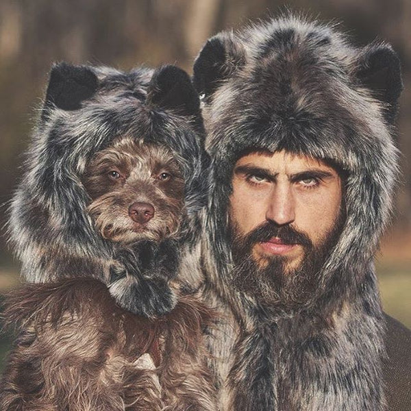 man and dog wearing matching faux fur hoods