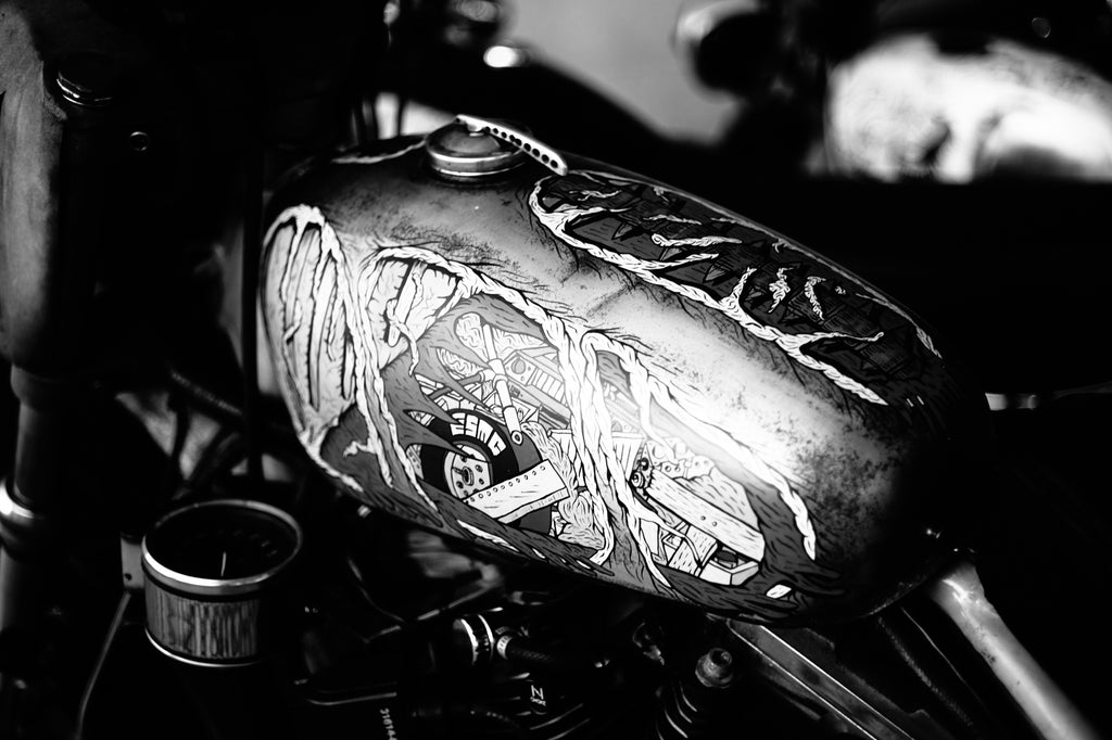 Custom hand-painted motorcycle gas tank at Wheels and Waves Festival 2015